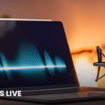 A studio microphone beside a laptop showing an audio waveform, illustrating live voice AI